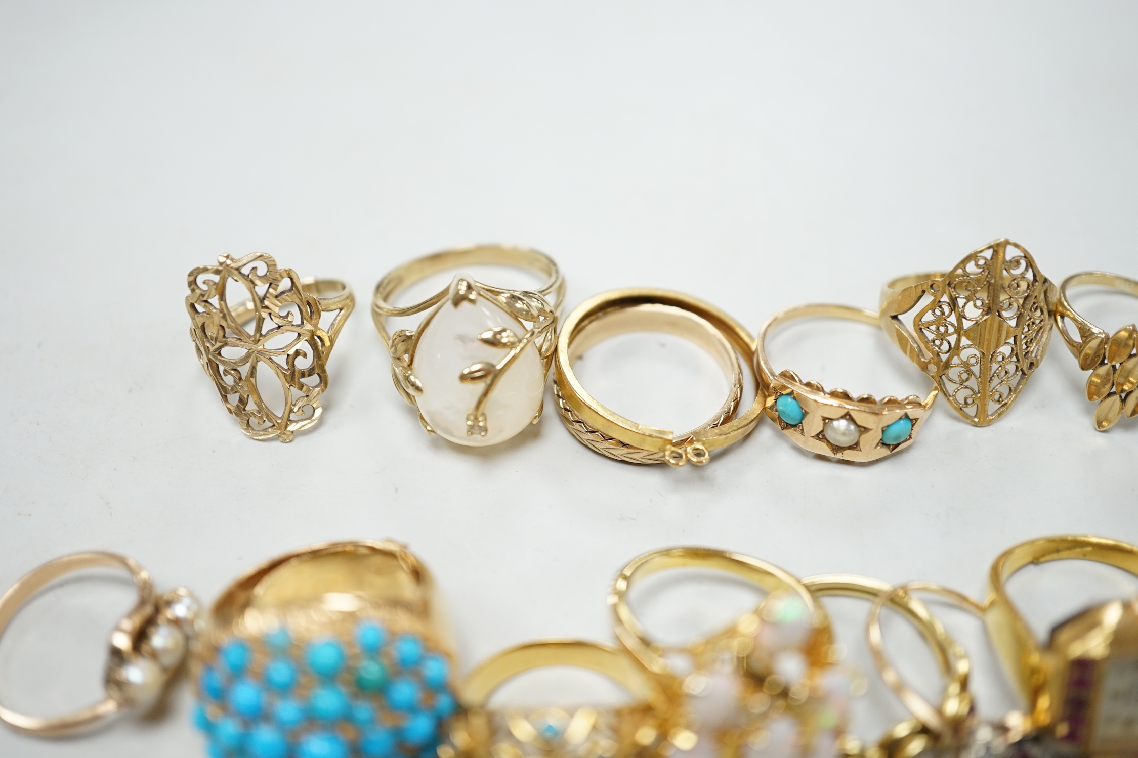 Three 18ct and gem set rings including star sapphire, turquoise and pearl and ruby and diamond three stone, five 9ct gold rings and a 9ct gold pendant mount and nine other rings including ring watch and Middle Eastern tu